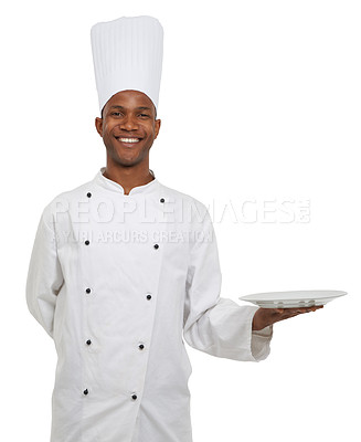 Buy stock photo Portrait, happy chef and empty plate presentation in studio isolated on white background mockup space. Smile, cooking and African man show dish in catering service, professional advertising or menu