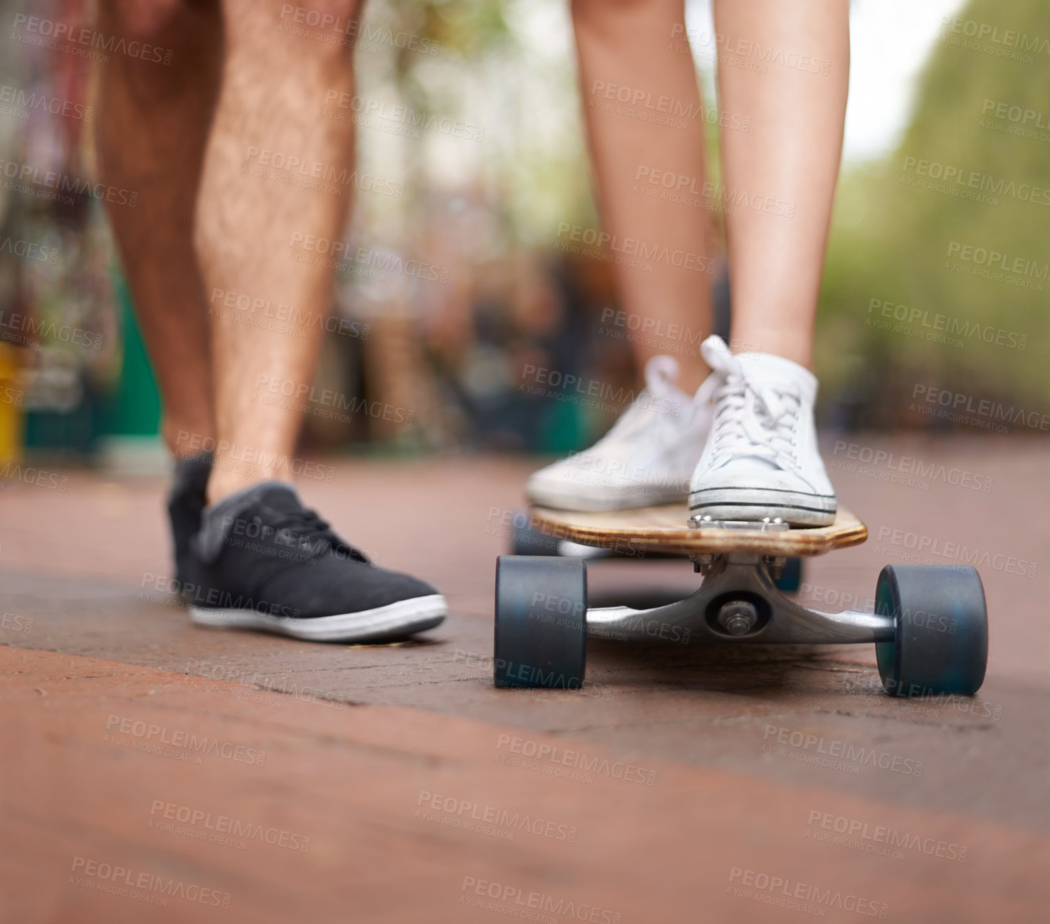 Buy stock photo Skateboard, learning and legs of couple of friends teaching partner skills, riding lesson or practice moving. Skate shoes, sneakers and closeup person coaching, help or support balance on ground