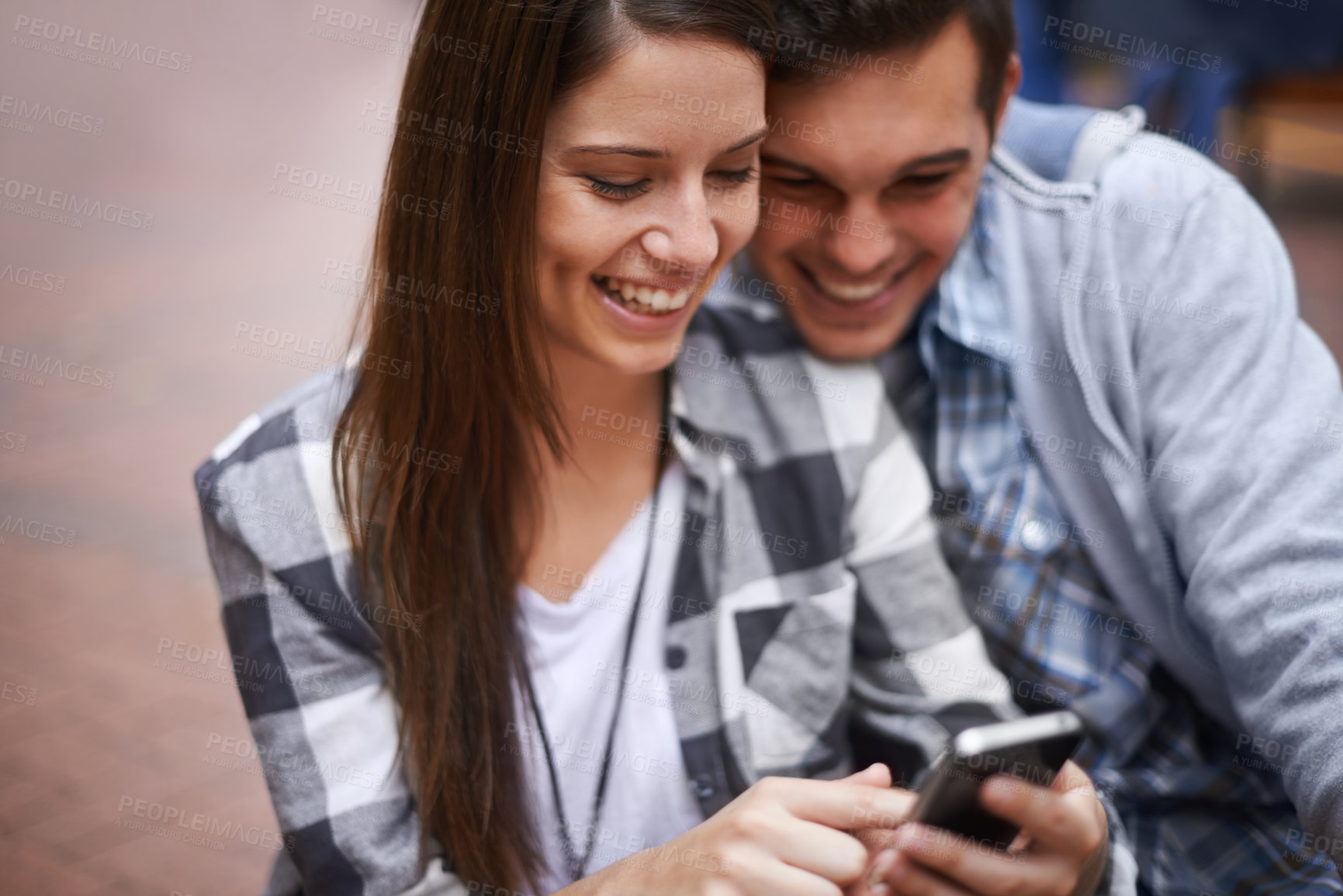 Buy stock photo Phone, smile and couple browsing social media together for love, communication or bonding on campus. App, education or internet with student man and woman reading university information on mobile