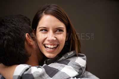 Buy stock photo Love, happy woman and face of couple hug together, excited and smile for studio reunion, care and romantic connection. Girlfriend embrace, happiness and relationship people bond on brown background