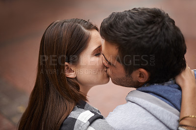 Buy stock photo Love, city and face of couple kiss, bonding together and enjoy outdoor date with care, support and partner commitment. Devotion, relationship connection and romantic people in sweet intimate moment 