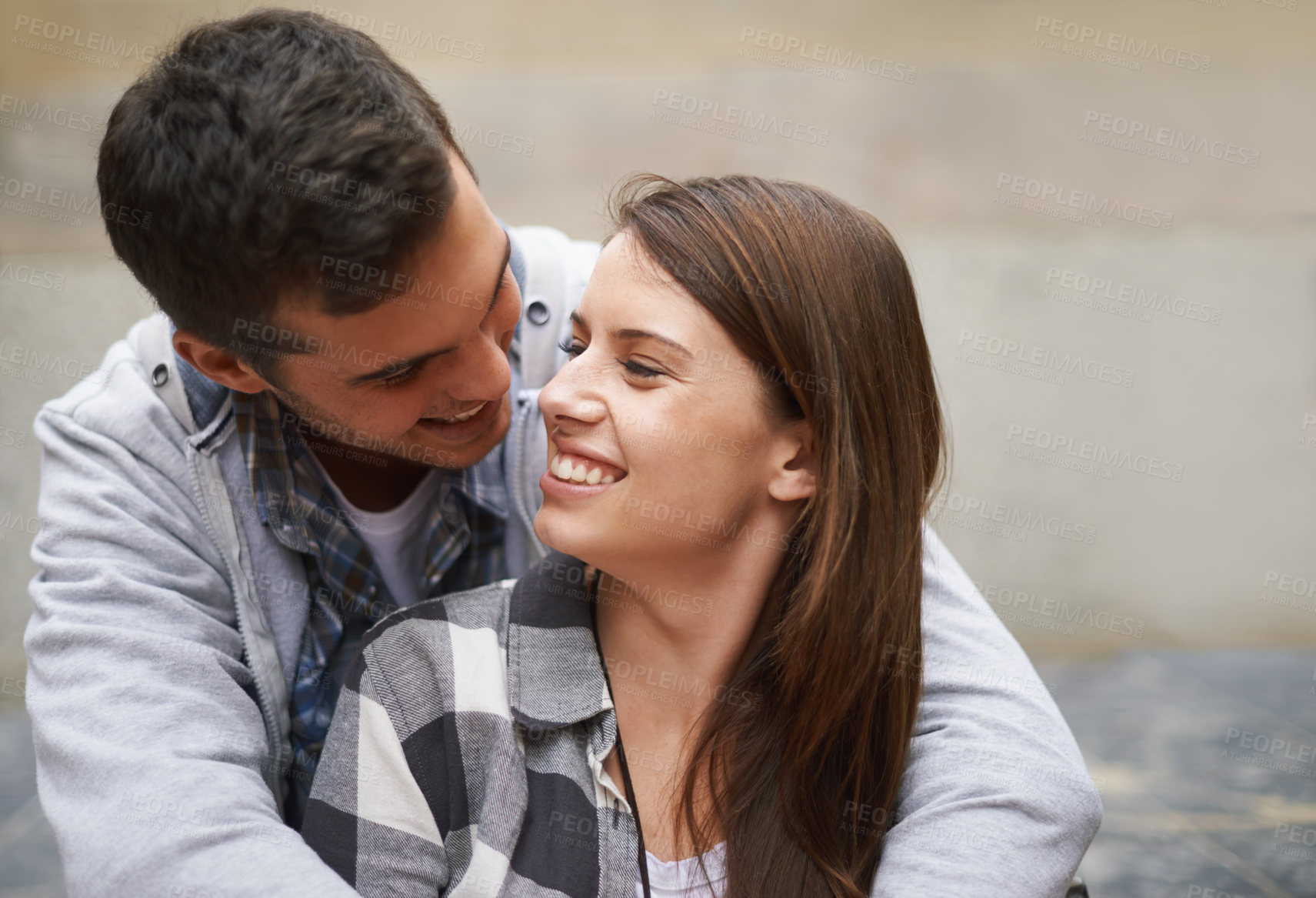 Buy stock photo Eye contact, happiness and face of couple hug together, relax and enjoy outdoor date for Valentines Day anniversary. Trust, connection and people smile for relationship security, soulmate or devotion