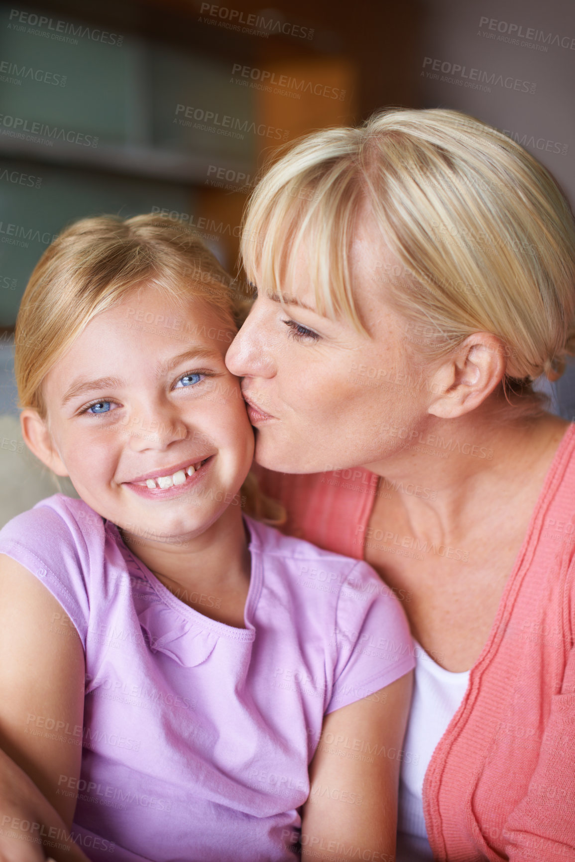 Buy stock photo Mother, girl and kiss for love in portrait, bonding and caring in childhood by single parent at home. Daughter, mommy and together in living room, embrace and security or happiness and connection