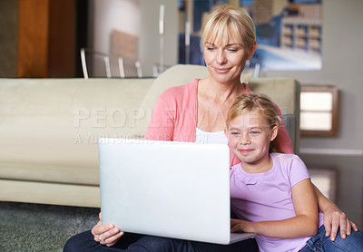 Buy stock photo Mother, child and relax by laptop on living room floor, happy and stream subscription in apartment. Daughter, woman and smile on computer by online cartoon, technology and connected on couch in house