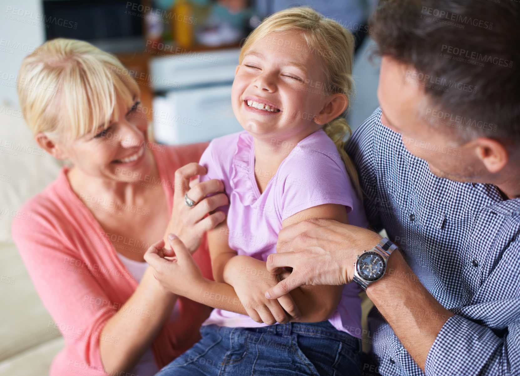 Buy stock photo Girl, parents and tickle for fun at home, security and love in childhood or happiness. Family, daughter and child playing games on vacation, smiling and connection or care in relationship on holiday