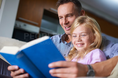 Buy stock photo Father, child and reading a book for education at home, story and fantasy fiction for homeschooling. Daddy, daughter and care for bonding, literacy and storytelling for language development or growth