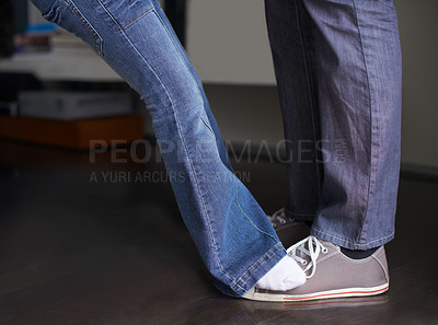 Buy stock photo Legs, kid dance with father and family bonding together in celebration at home. Child, dad and closeup of feet moving to music, learning or parent teaching girl for performance in house while playing