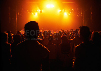 Buy stock photo A crowd of people watching a band play on stage at a music concert. This concert was created for the sole purpose of this photo shoot, featuring 300 models and 3 live bands. All people in this shoot are model released.