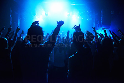 Buy stock photo Nightclub, people and crowd with energy and lights for party, concert or rave festival with spotlight and dancing. Disco, psychedelic event and performance with entertainment, audience and rear view