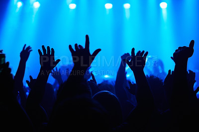 Buy stock photo Club, concert and audience with hands or lights for music, party and rave festival with spotlight and dancing. Disco, psychedelic event and performance with entertainment, crowd and rear view gesture