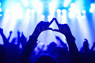 Buy stock photo Nightclub, concert and audience with hands or sign for music, party and rave festival with spotlight and dancing. Disco, rock event and performance with entertainment, crowd and rear view gesture