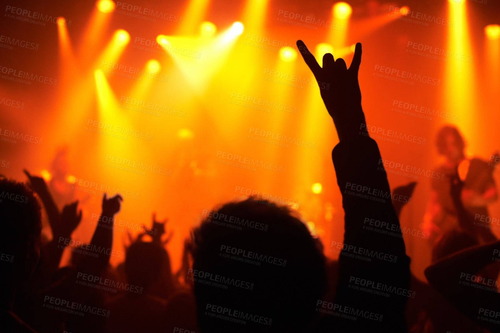 Buy stock photo Nightclub, concert and audience with rock or sign for music, band and rave festival with silhouette, dancing or show. Disco, live event and performance with entertainment, crowd and rear view gesture