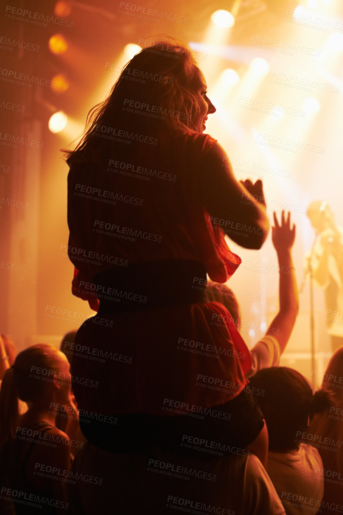 Buy stock photo Concert, woman and friends at festival with piggyback for party, nightclub and dancing with spotlight and lights. Disco, psychedelic event and performance with entertainment, crowd and rear view