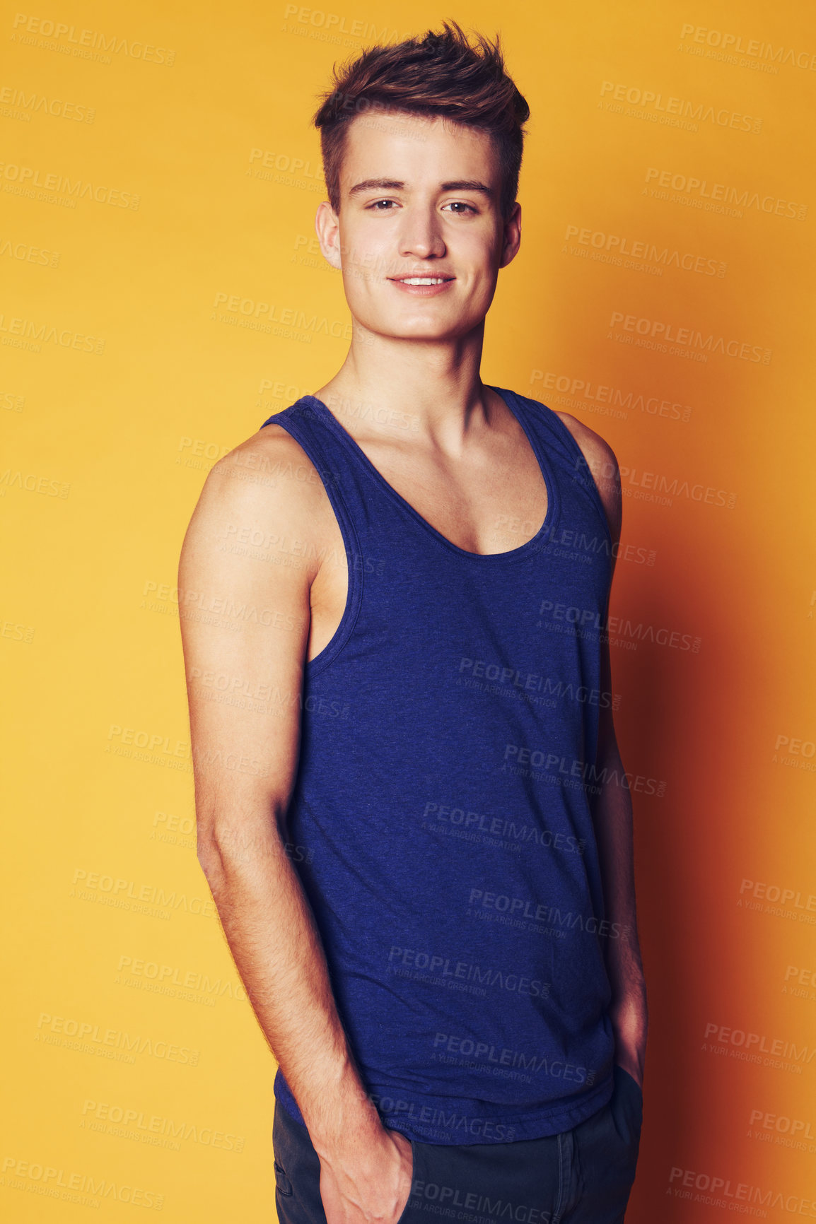 Buy stock photo Fashion, smile and portrait of man in studio with trendy, cool or summer clothes on orange background. Face, style and male model with confidence, personality or casual, streetwear or outfit choice