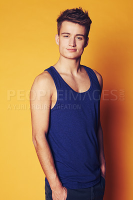 Buy stock photo Portrait, fashion and man with style, student and confident guy on an orange studio background. Face, person and model with joy, casual outfit and stylish clothes with gen z, trendy and aesthetic