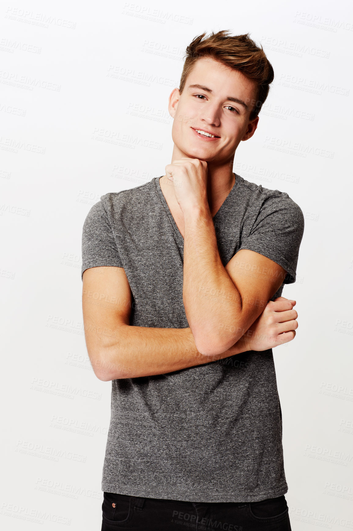 Buy stock photo Studio shot of a young man wearing casual clothes and smiling at the camera