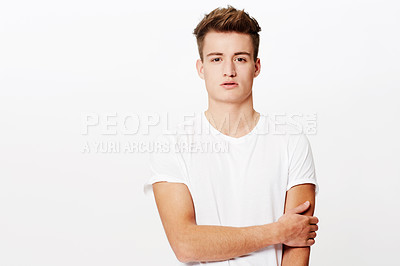 Buy stock photo Portrait, fashion and relax with casual man in studio isolated on white background for classic style. Model, clothes and serious with confident young person in t-shirt or clothing outfit on mockup