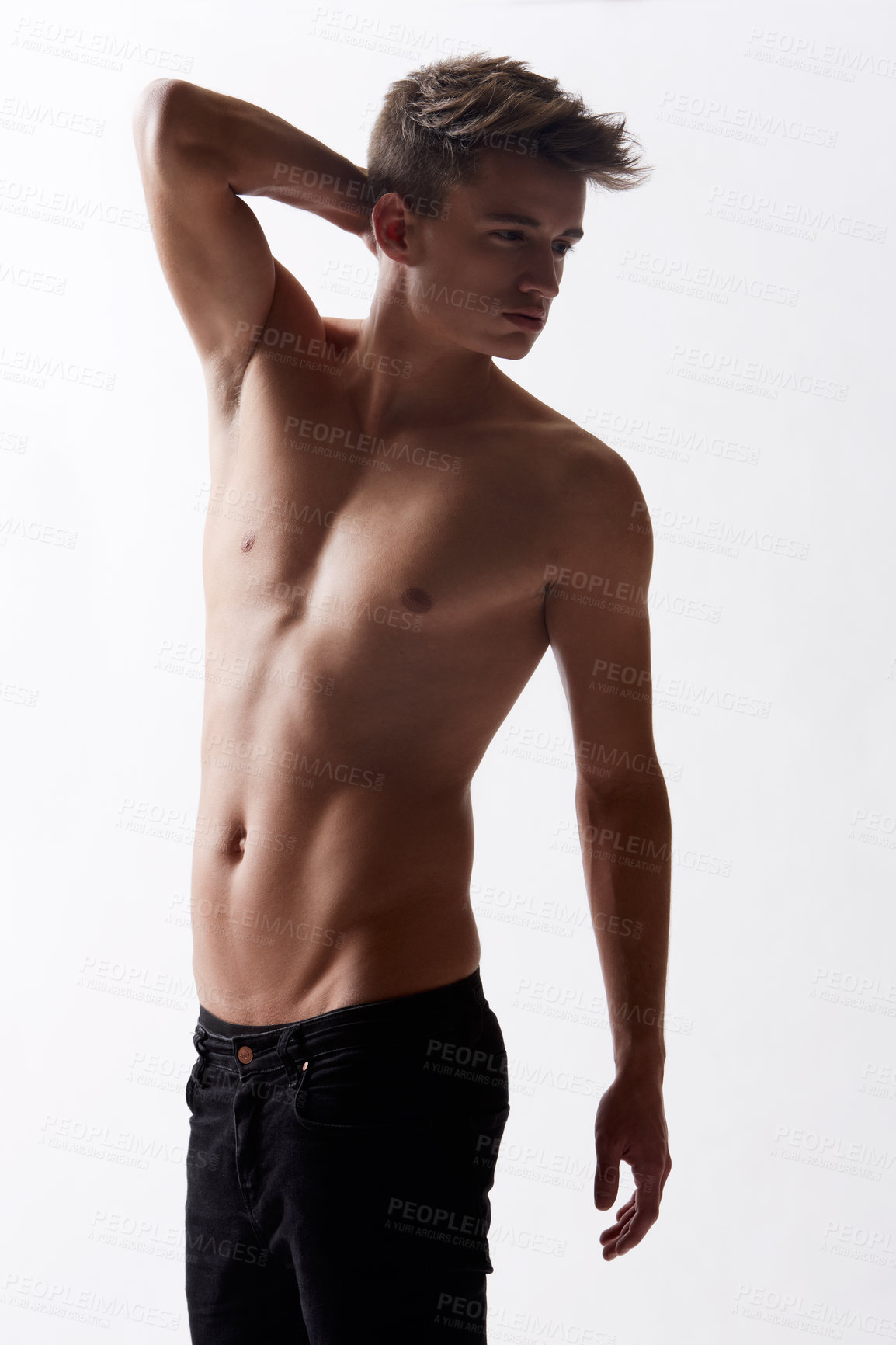 Buy stock photo Topless, natural and masculine with body of man in studio on white background for health or wellness. Aesthetic, skin or stomach and young shirtless model in jeans for hygiene and satisfaction