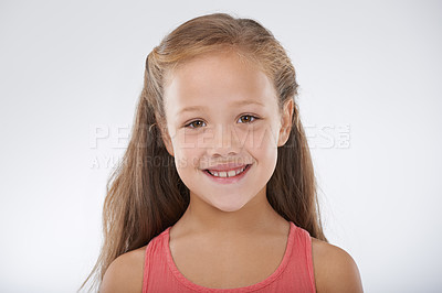 Buy stock photo Child, girl and portrait or happiness in studio with confidence, positive attitude and carefree youth. Kid, face and smile with calm expression, mock up space and casual outfit on white background