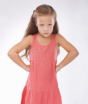 Buy stock photo Portrait, unhappy or tantrum and girl child in studio on white background with anger and frustration. Cross, problem or moody and young kid with bad attitude looking upset at problem or mistake