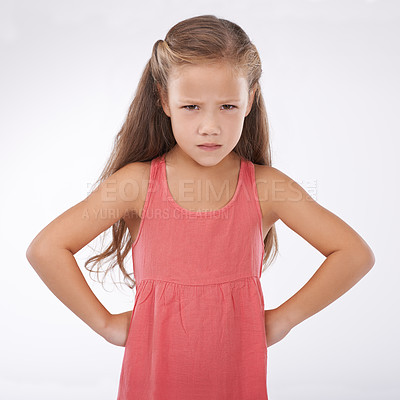 Buy stock photo Child, portrait and unhappy grumpy in studio or bad mood discipline or development, trouble or angry. Female person, hands and hips in frustration for girl kid as white background, attitude or mockup