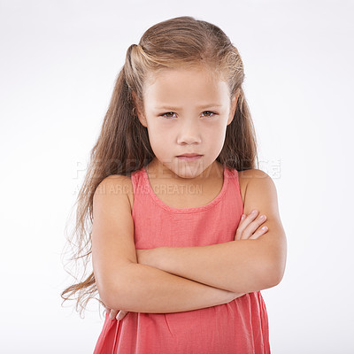 Buy stock photo Portrait, unhappy and girl child arms crossed in studio on white background with anger and frustration. Problem, tantrum or moody and young kid with bad attitude looking upset at mistake or error