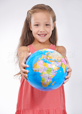 Buy stock photo Kid, portrait and globe in studio with world, planets and city for education, geography and happy. Student, girl child and travel map with smile for earth day support or lesson on white background