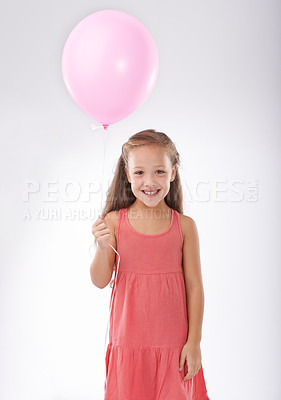 Buy stock photo Girl, child and balloon in portrait, party or birthday with decoration for celebration, youth and happiness. Studio, young kid with toys and excited for anniversary with childhood on white background