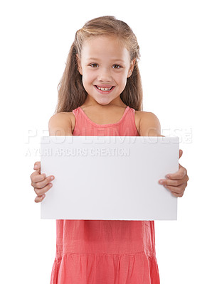 Buy stock photo Paper, mockup and portrait of child advertising space, broadcast news and presentation in studio on white background. Happy kid, girl and poster sign for feedback, offer and information about us