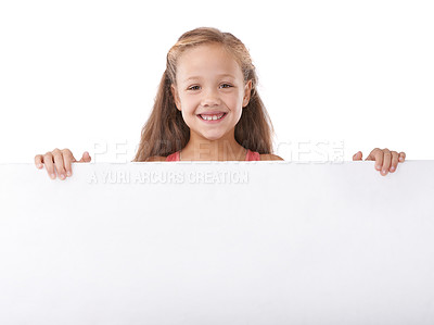 Buy stock photo Poster, portrait and child advertising space, broadcast news and commercial presentation in studio on white background. Happy girl, kid and sign board for feedback, launch and information coming soon