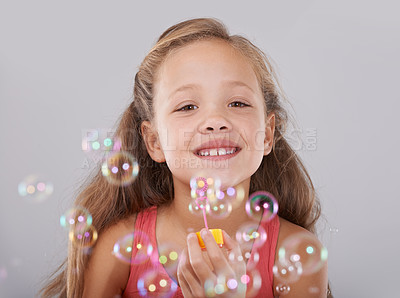Buy stock photo An adorable little girl surrounded by bubbles