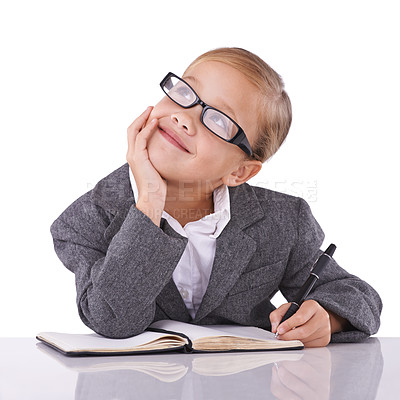 Buy stock photo Young child, writing and dreaming in studio for business, career and happy with idea of office job. Little girl, suit or positive for future as pretend accountant or cute glasses by white background
