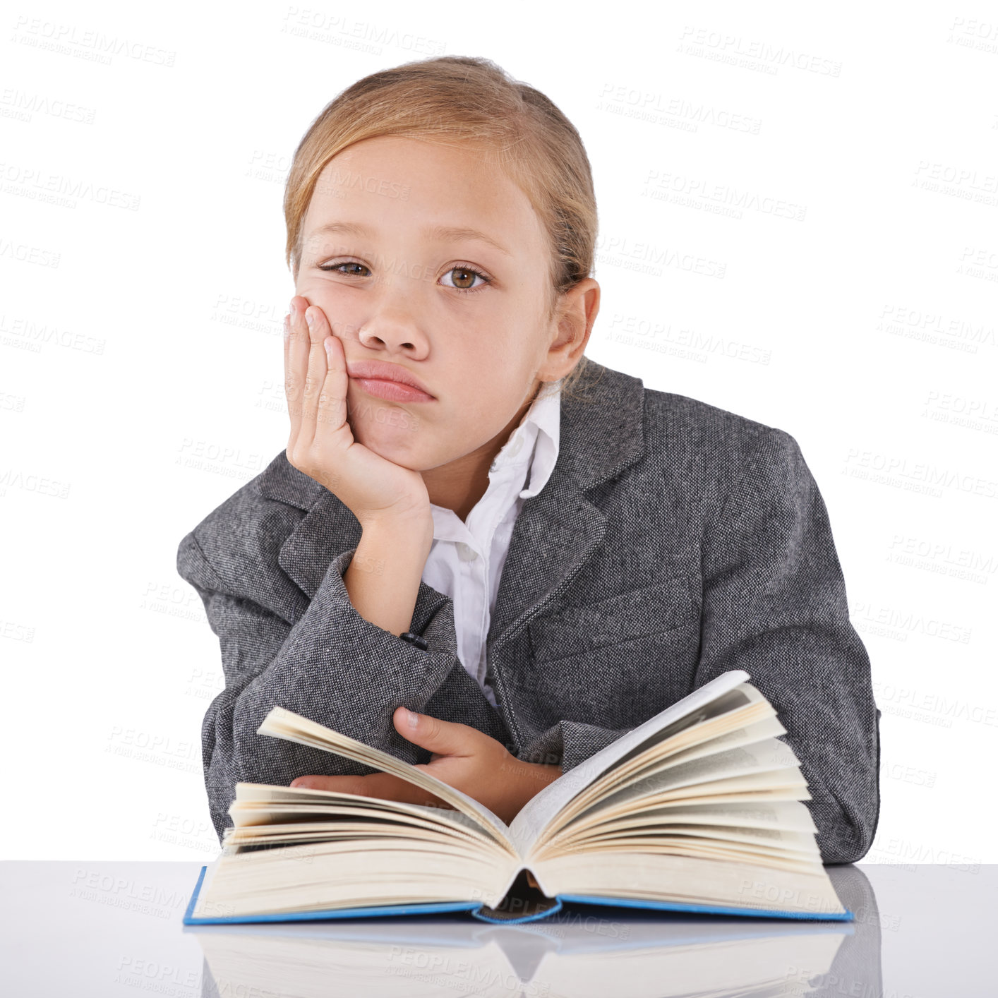 Buy stock photo Bored, child and reading book in studio portrait, learning and fiction novel on white background. Female person, fatigue and information for education, exhausted and tired for studying literacy