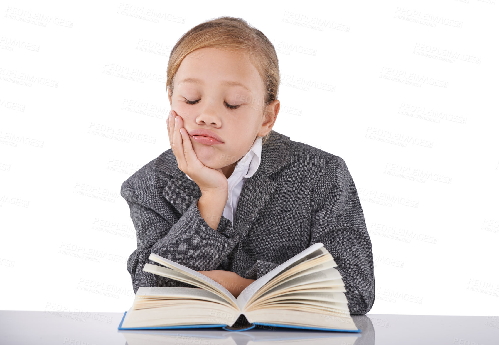 Buy stock photo Sleeping, child and reading book in studio, learning and fiction novel on white background. Female person, fatigue and info for education, exhausted and tired for studying literacy and knowledge