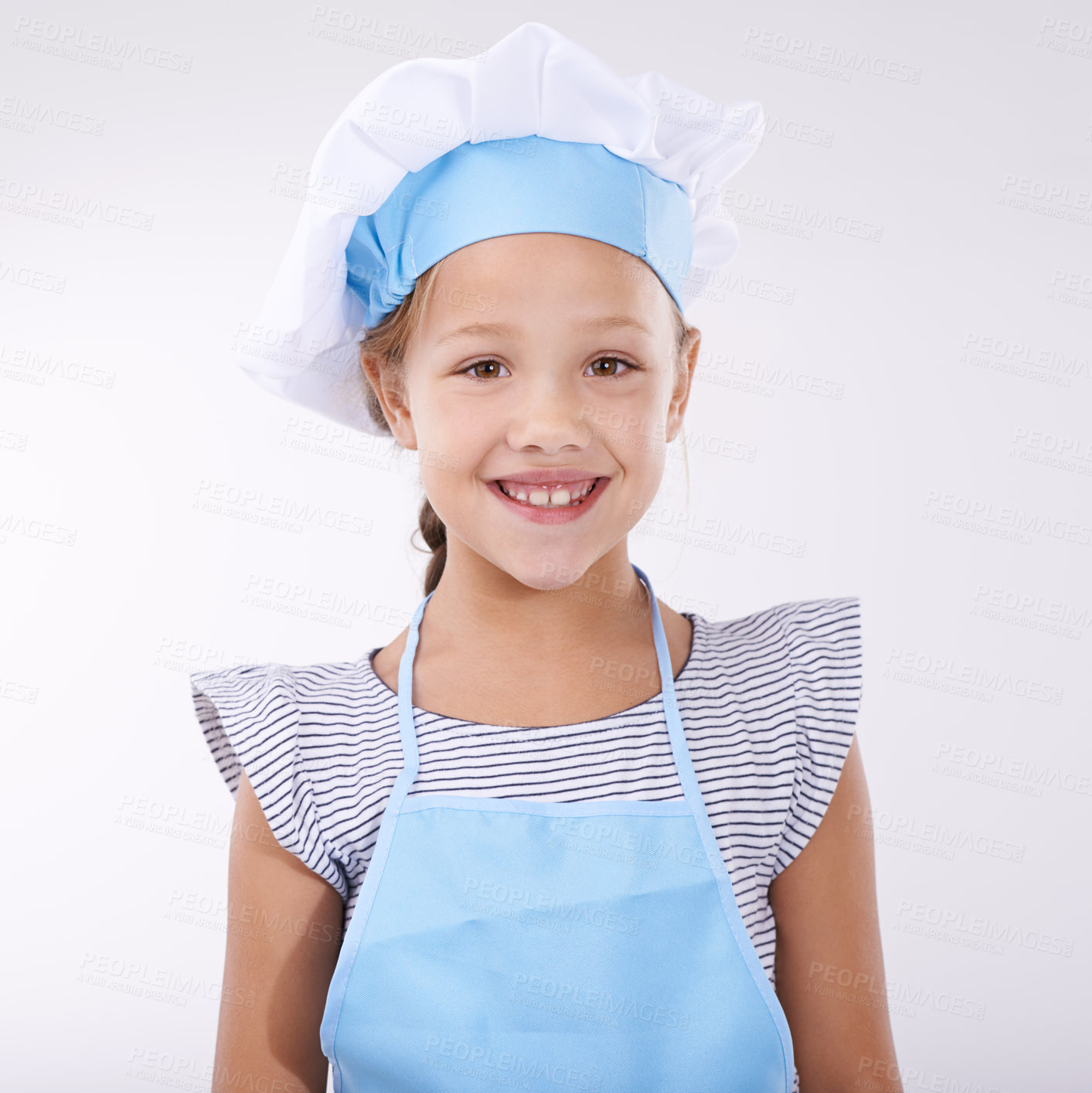 Buy stock photo Kid, chef and portrait with apron, confident and child development on white background. Culinary skills, happy and ready to cook, food and childhood growth with confidence in hospitality industry