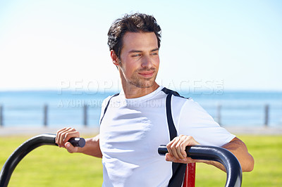 Buy stock photo Man, fitness and shoulder press at park for workout, exercise or training in nature by the beach gym. Fit, active or strong male exercising on outdoor machine for muscle, chest or healthy cardio