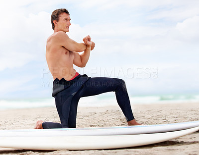 Buy stock photo Surfer, man is stretching and beach with surfboard for ocean waves and start fitness, adventure and travel. Nature, vacation and surfing in Hawaii, summer holiday on an island and extreme sports