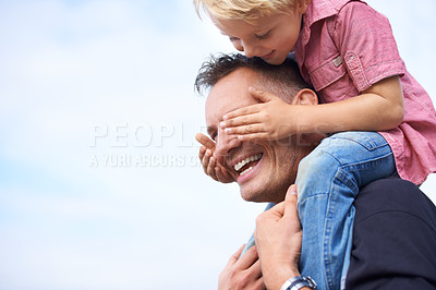 Buy stock photo Family, love and father piggyback with son on blue sky space together for fun or bonding in summer. Face, smile or happy with man parent and excited boy child playing outdoor in park or garden