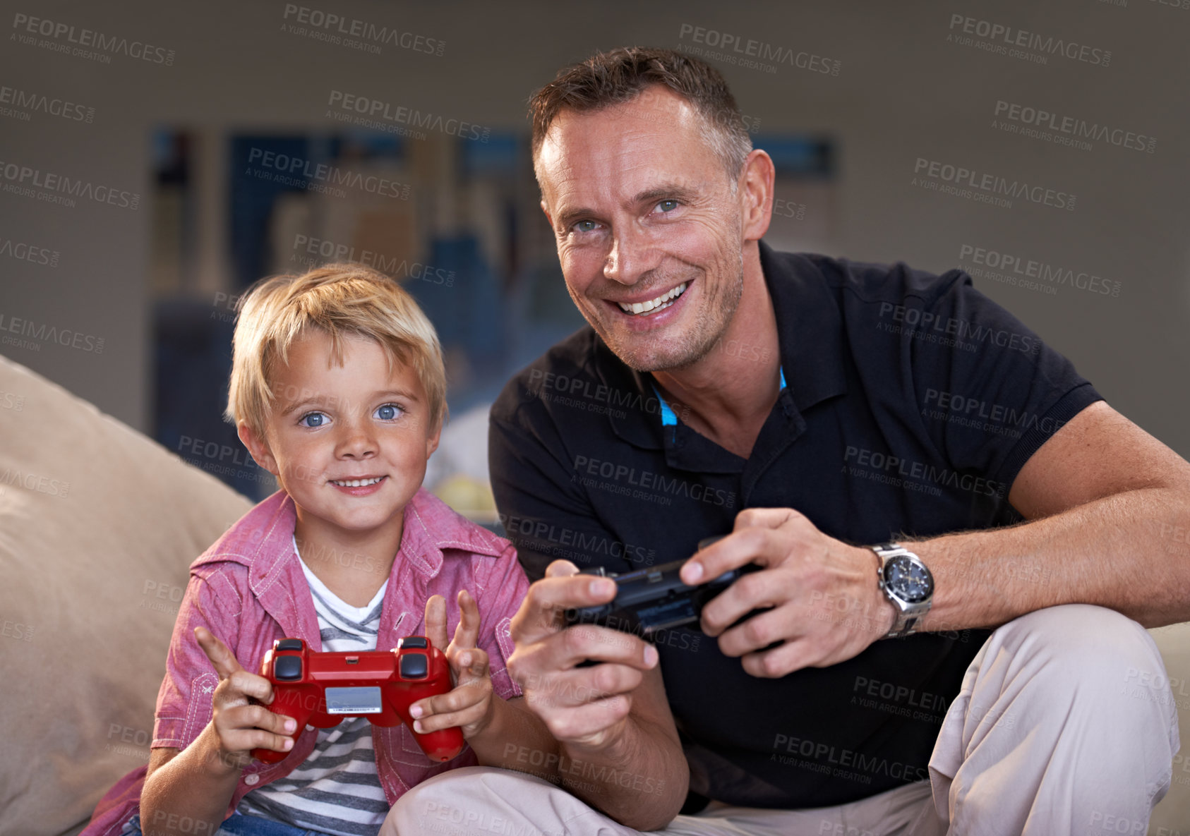 Buy stock photo Family, father and son gaming on sofa in living room of home together for love, competition or child development. Video game, controller and next level with man parent gamer teaching boy child