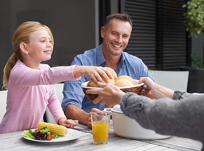 Buy stock photo A family enjoying lunch together outside
