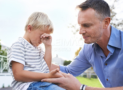 Buy stock photo Crying, comfort and dad outside with child, pain and help with emotional boy in garden of home. Love, support and tears, sad kid and dad in backyard with empathy, injury and care for childhood stress