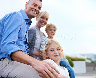 Buy stock photo Happy, parents and children outdoor in portrait at house in summer with love, freedom and together on blue sky. Family, care and support kids with smile in backyard at home with mother and father