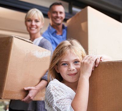 Buy stock photo A family of three carrying boxes into their new home
