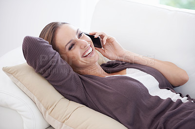 Buy stock photo Woman, laugh and relax on sofa for phone call, communication and mobile networking at home. Happy lady, smartphone and audio contact for funny conversation, gossip and digital connection in lounge 