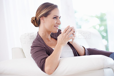 Buy stock photo Thinking, coffee and happy woman relax on a sofa with memory, moment or reflection in her home. Tea, break and female person in a living room with comfort, beverage or day off, me time or self care