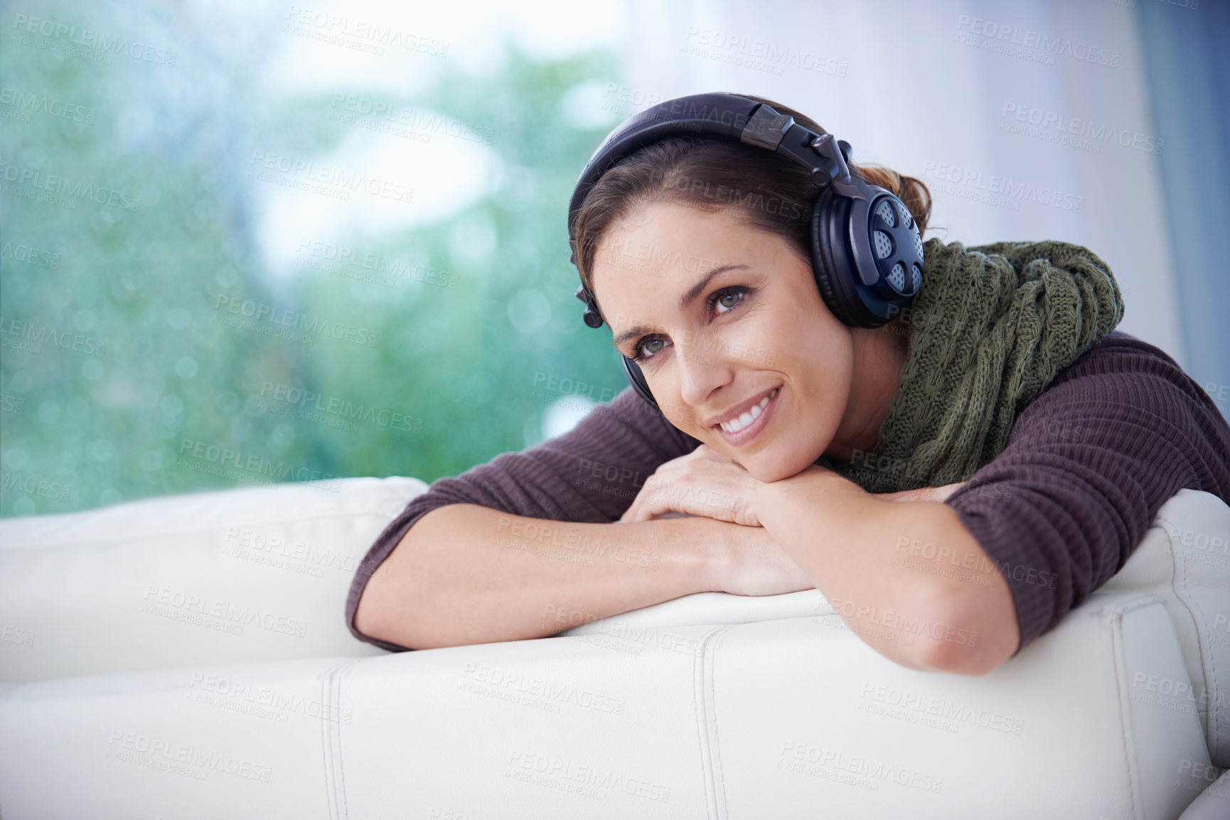 Buy stock photo Relax, smile and woman with music headphones on a sofa streaming, listening or chilling at home. Happy, thinking and female person in a living room with earphones for radio, audio or playlist track