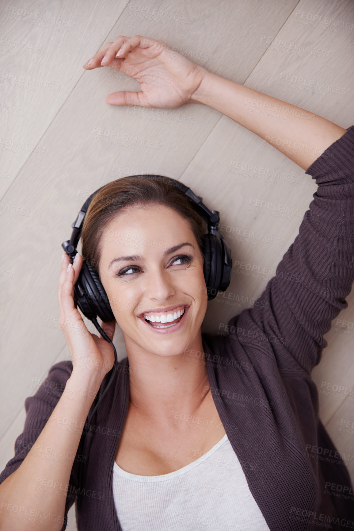 Buy stock photo Top view, headphones or happy woman on floor for music streaming, mental health or wellness. Smile, thinking or fun female person on break listening to audio, radio song or track to relax in home