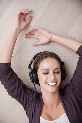Buy stock photo Woman, headphones to listen to music and top view, happiness and relax at home with technology. Podcast, radio and audio streaming, peace and laying on apartment floor with smile, calm and album