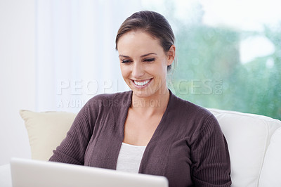 Buy stock photo Happy, woman or laptop for remote work on sofa to update blog post, social media or reading digital research. Freelancer, computer or download movie subscription, online shopping or elearning at home