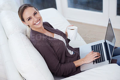 Buy stock photo Portrait, laptop and happy woman on a sofa with coffee while streaming movie, film or video at home. Pc, face or female person in a living room with tea, break or social media, subscription or show